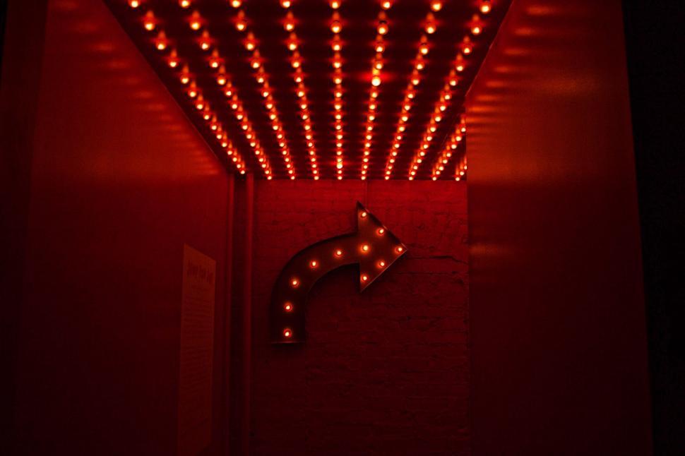 Free Image of Red Light Shining on Wall 