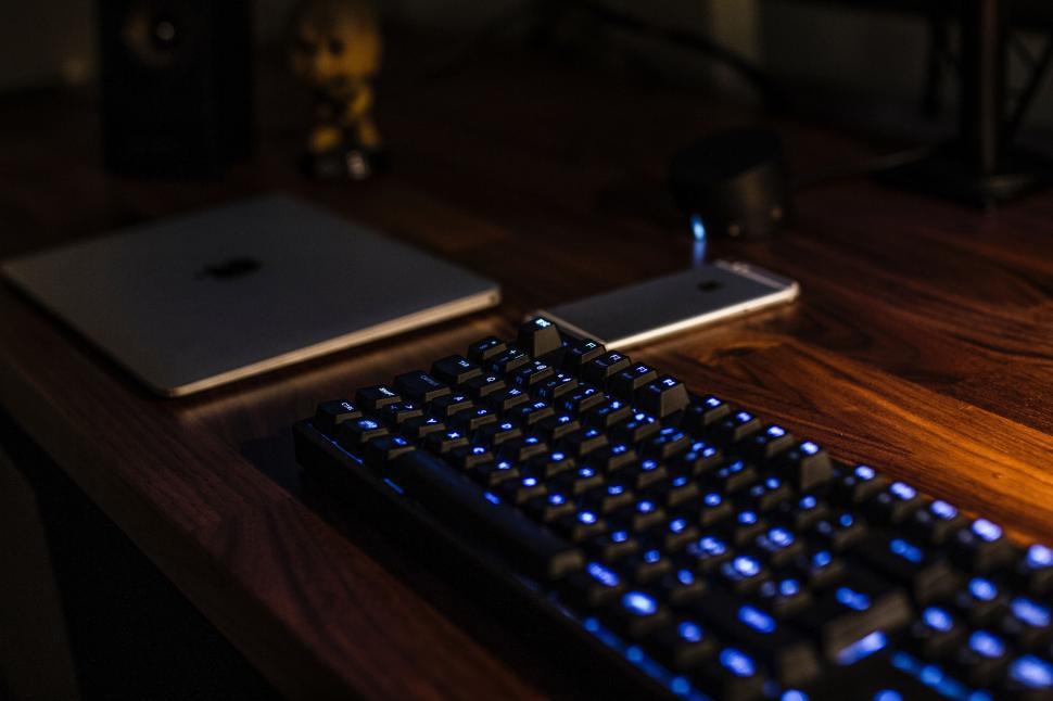 Free Image of Computer Keyboard on Wooden Desk 