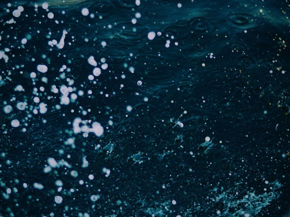 Free Image of Close Up of Water Bubbles on Dark Blue Background 