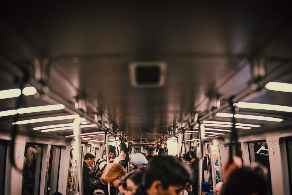 Free Image of Group of People Riding on a Subway Train 