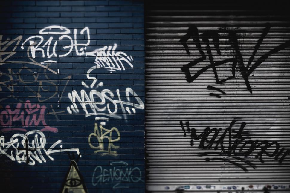 Free Image of Graffiti-Covered Wall Next to Closed Door 