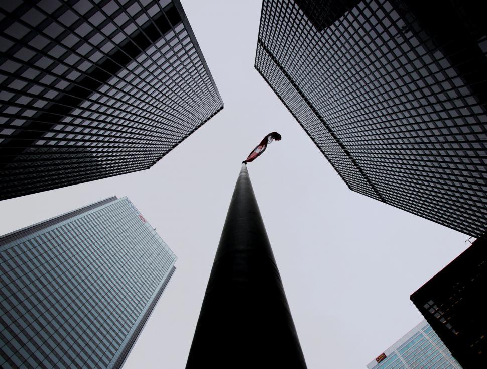 Free Image of Person Standing Among Tall Buildings 