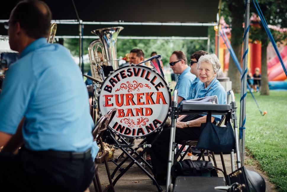 Free Image of Elderly Woman in Wheelchair Sitting Next to Band 
