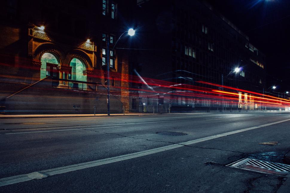 Free Image of City Street at Night With Red Lights 