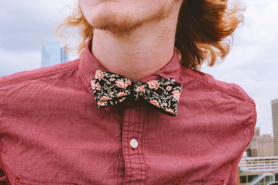 Free Image of Man With Long Hair Wearing a Bow Tie 