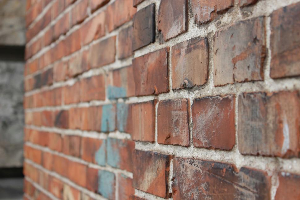 Free Image of Close Up of Brick Wall With Blue Paint 