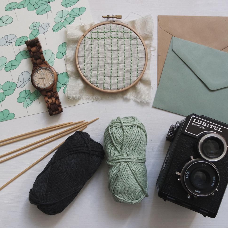 Free Image of Table With Camera, Yarn, and Watch 