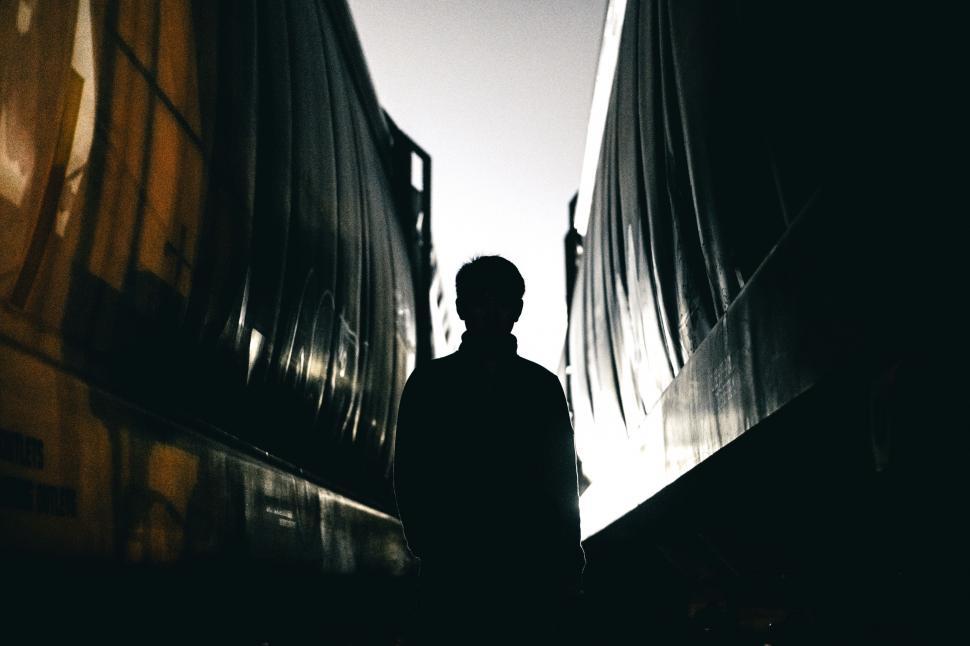 Free Image of Man Standing in Dark Alley 