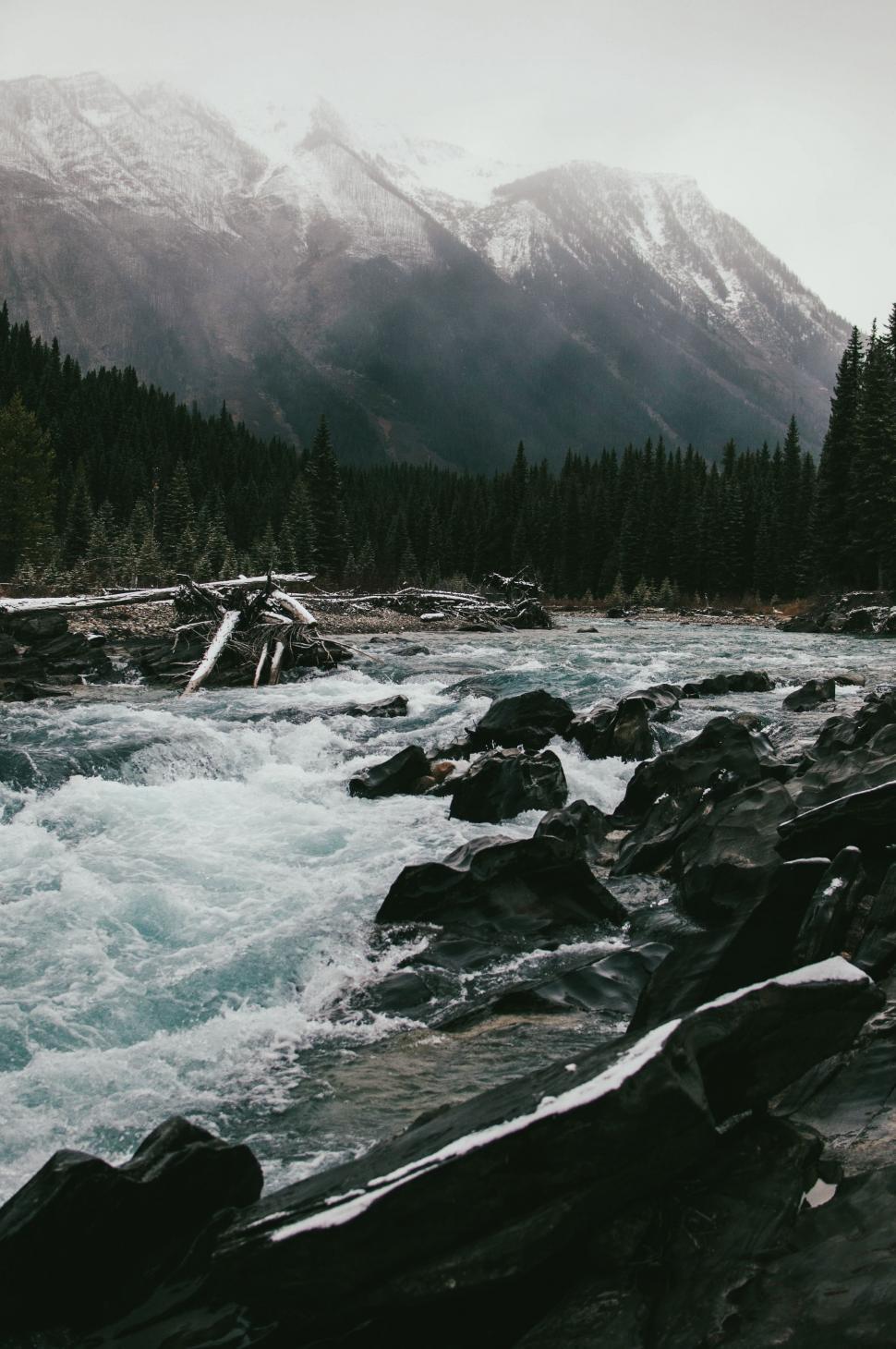 Free Image of River Flowing Through Mountainous Landscape 