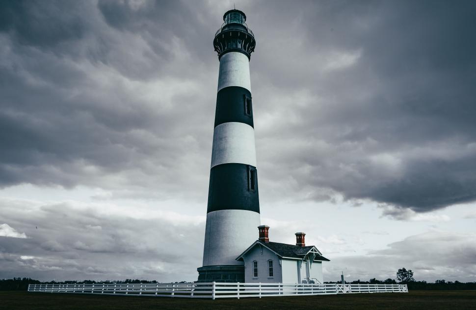 Free Image of Iconic Lighthouse Standing Tall Against the Sky 