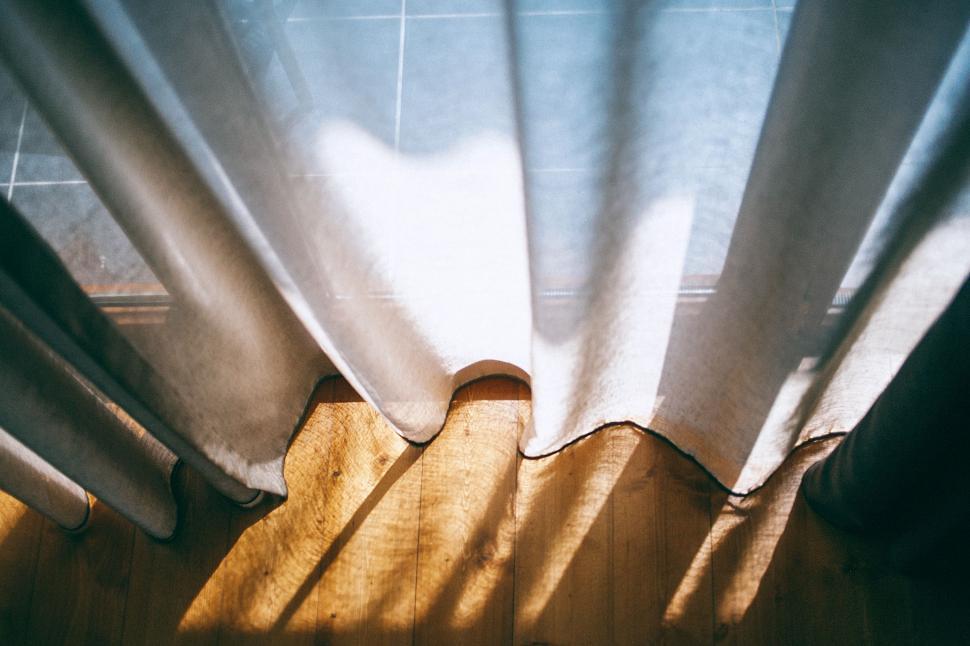 Free Image of Close Up of a Curtain on a Wooden Floor 