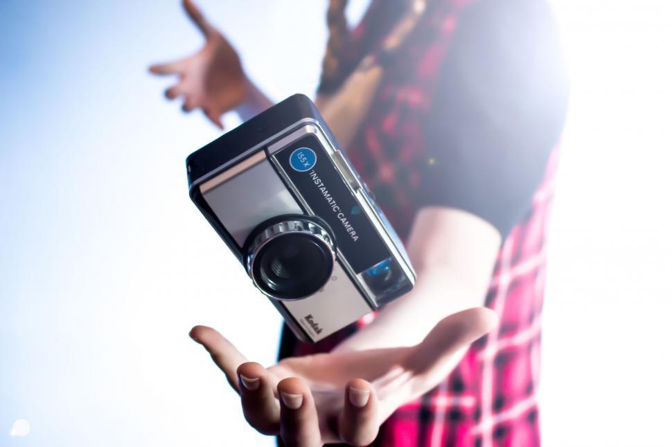 Free Image of Person Holding Camera 