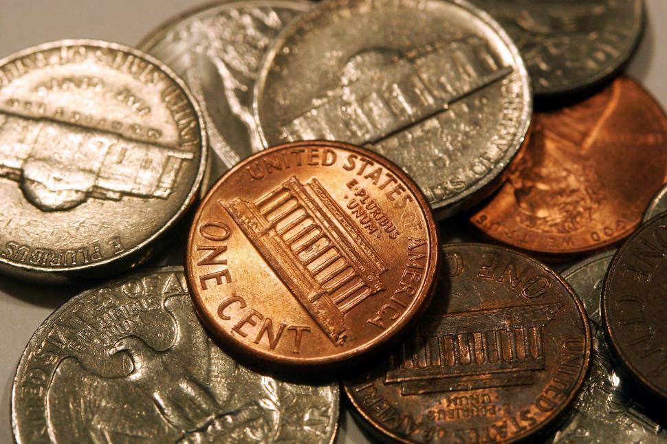 Free Image of money currency dollars commerce numbers coins penny copper pennies nickels quarters cents eagles monuments tails heads united states plurbious unum america 