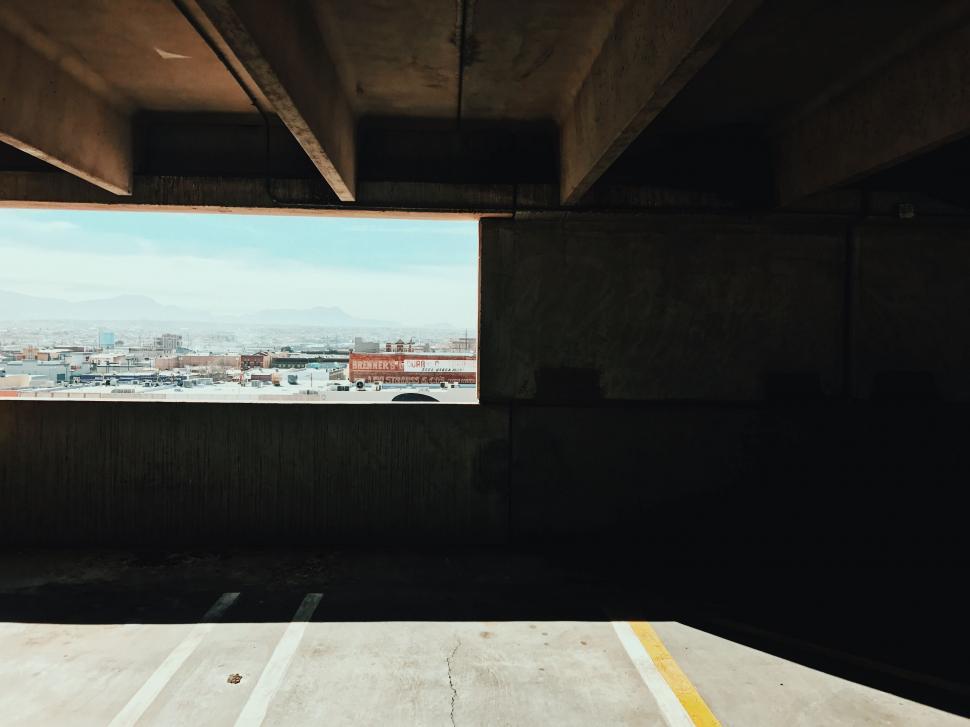 Free Image of Empty Parking Garage Overlooking Cityscape 