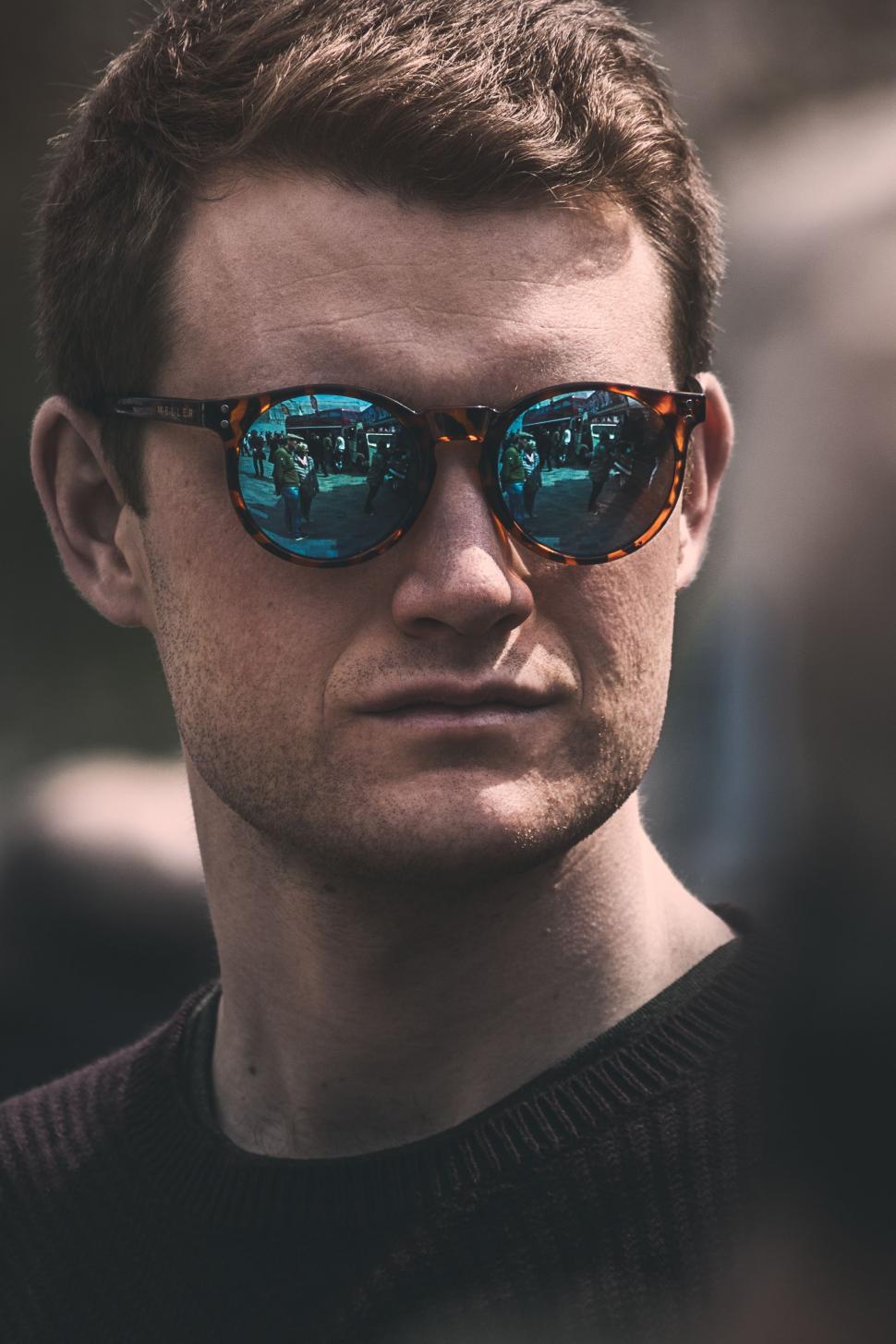 Free Image of Man Wearing Sunglasses Looking at Camera 