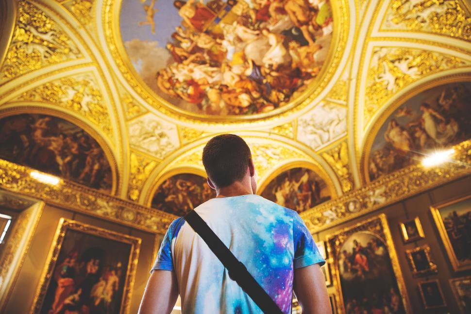 Free Image of Man Standing in Front of Ceiling Paintings 