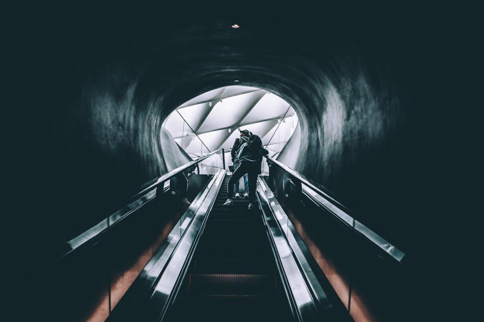 Free Image of Person Riding Escalator in Tunnel 