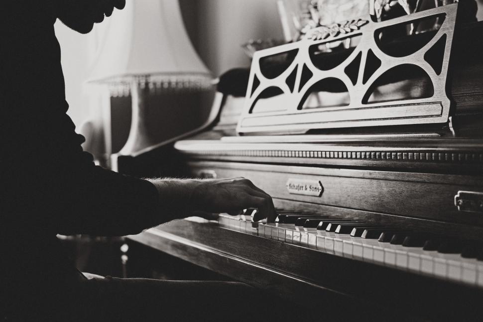 Free Image of Man Playing Piano in Black and White 