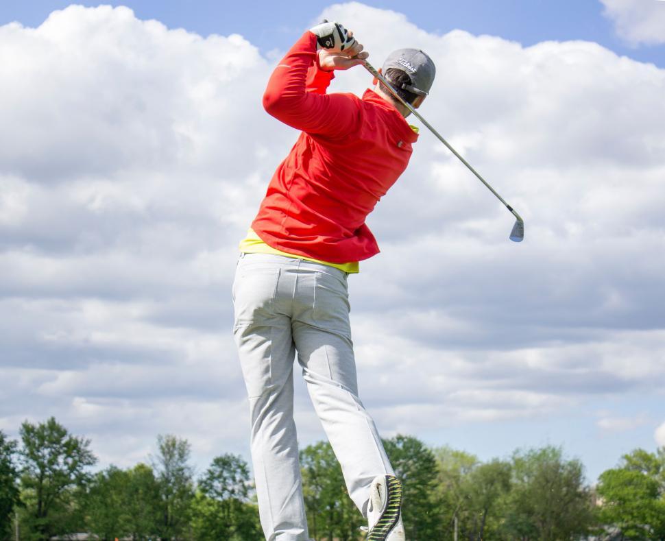 Free Image of Man Swinging Red Shirt Golf Club 