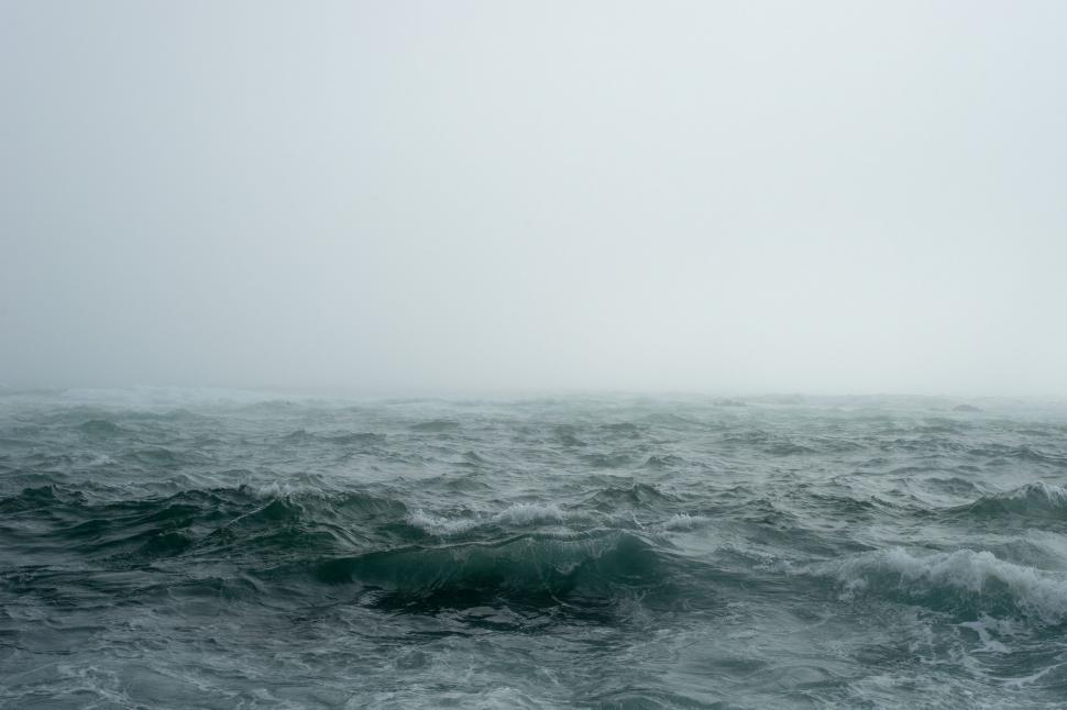 Free Image of Boat Drifting in Ocean Fog 