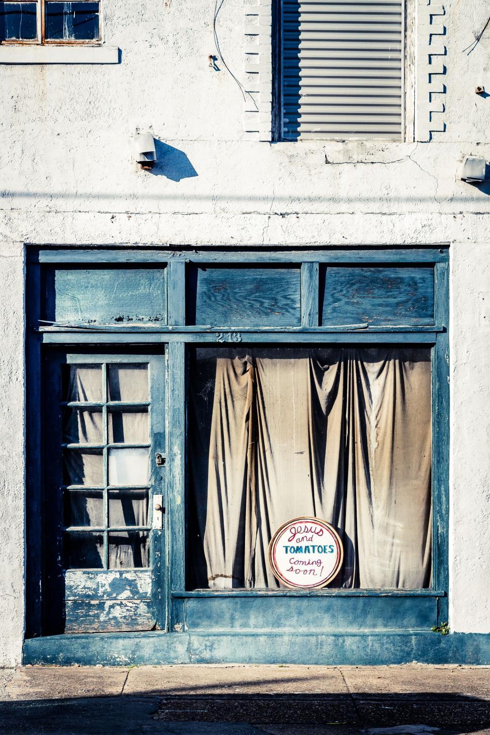 Free Image of Old Building With Open Door Sign 