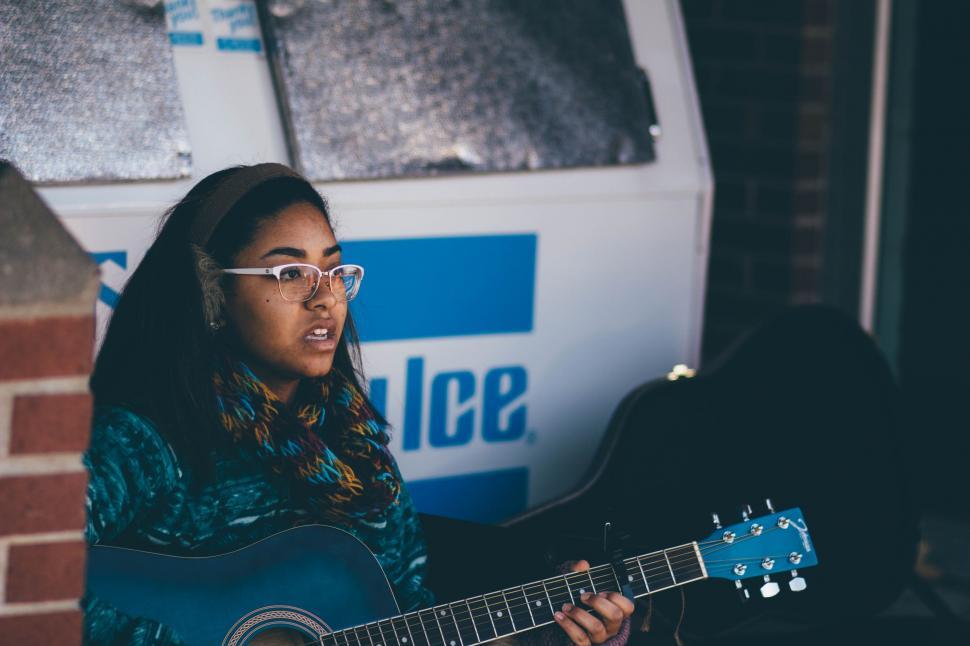 Free Image of Girl With Glasses Playing Guitar 