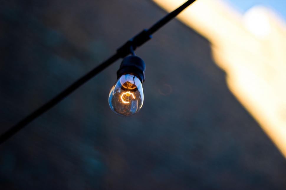 Free Image of Close Up of a Light Bulb on a Wire 