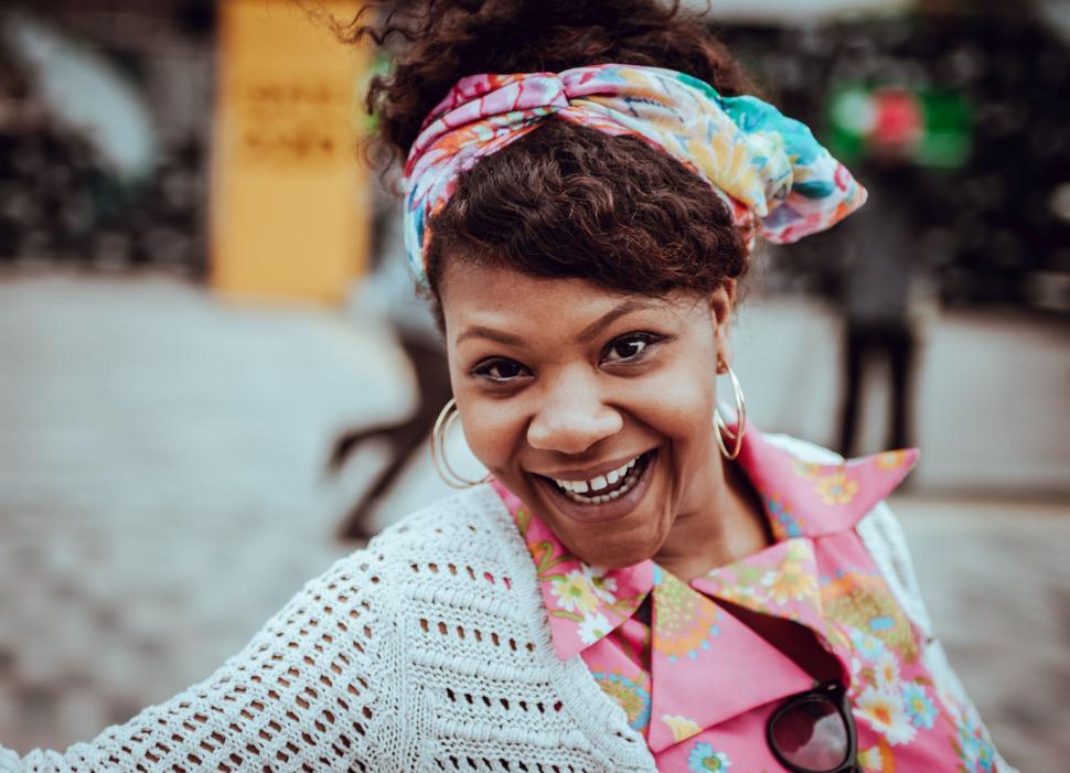 Free Image of Smiling Woman With Colorful Scarf 