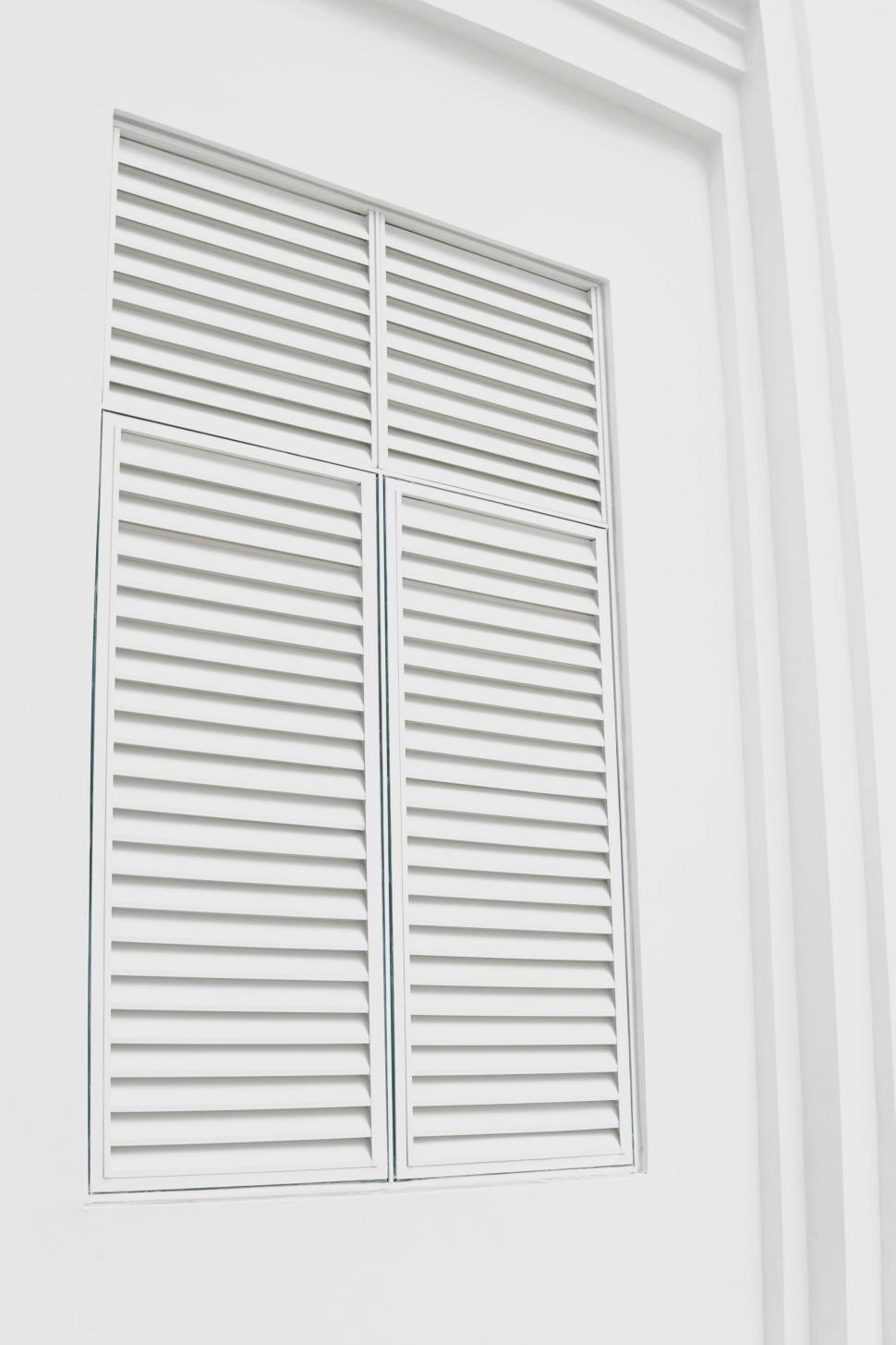 Free Image of White Window With Shutters on a White Wall 