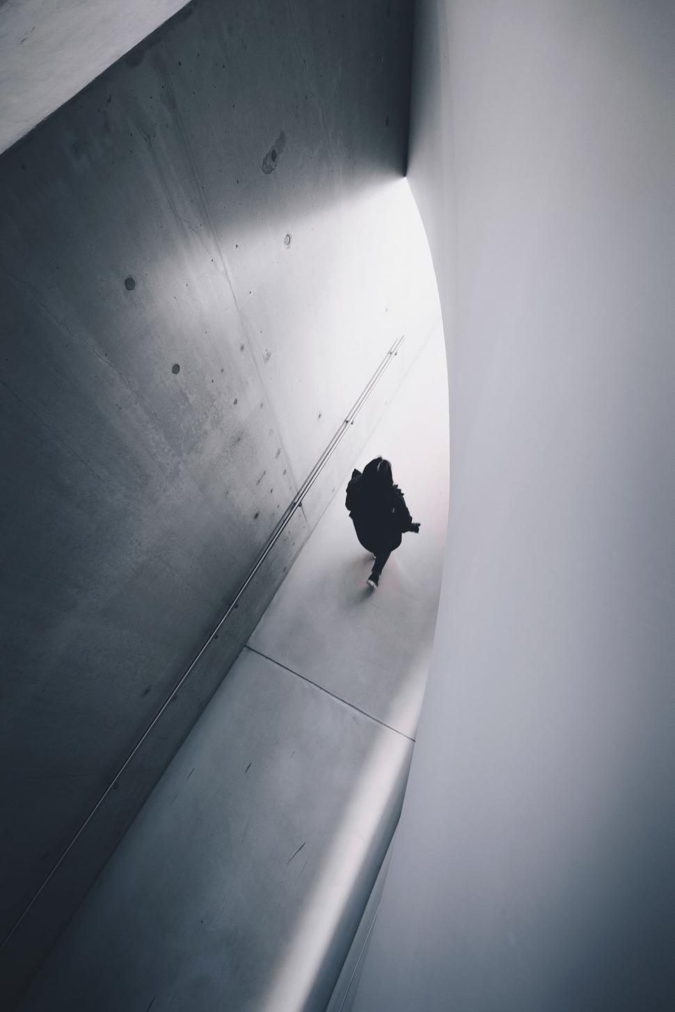 Free Image of Person Walking in Tunnel 