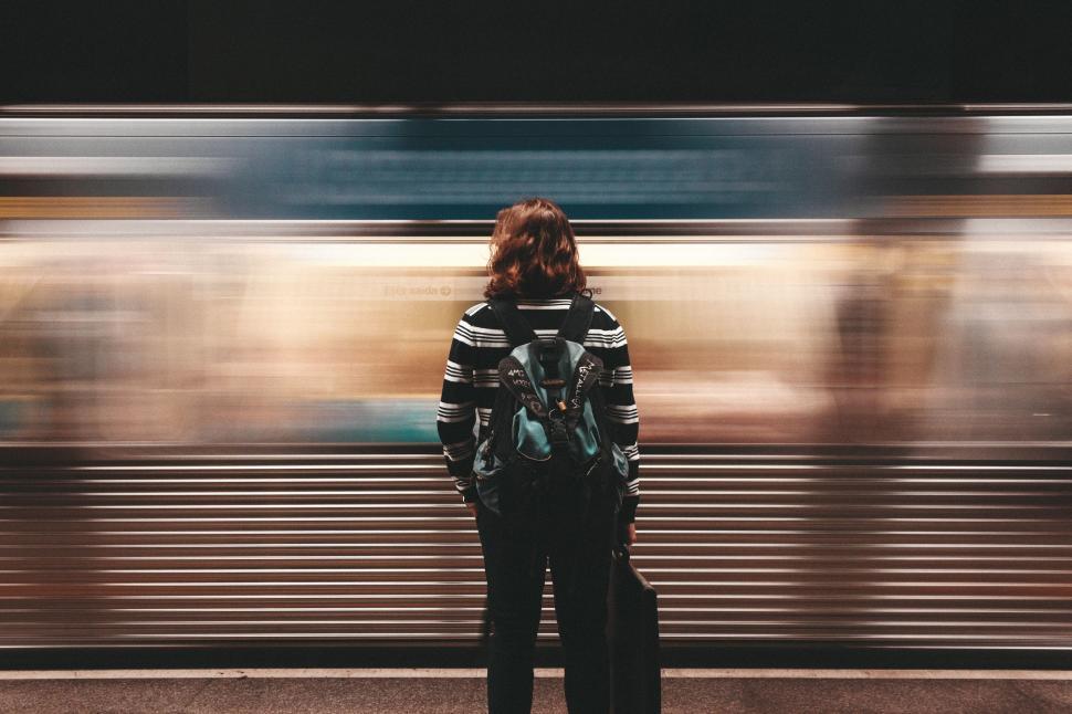 Free Image of Person Standing in Front of Train 