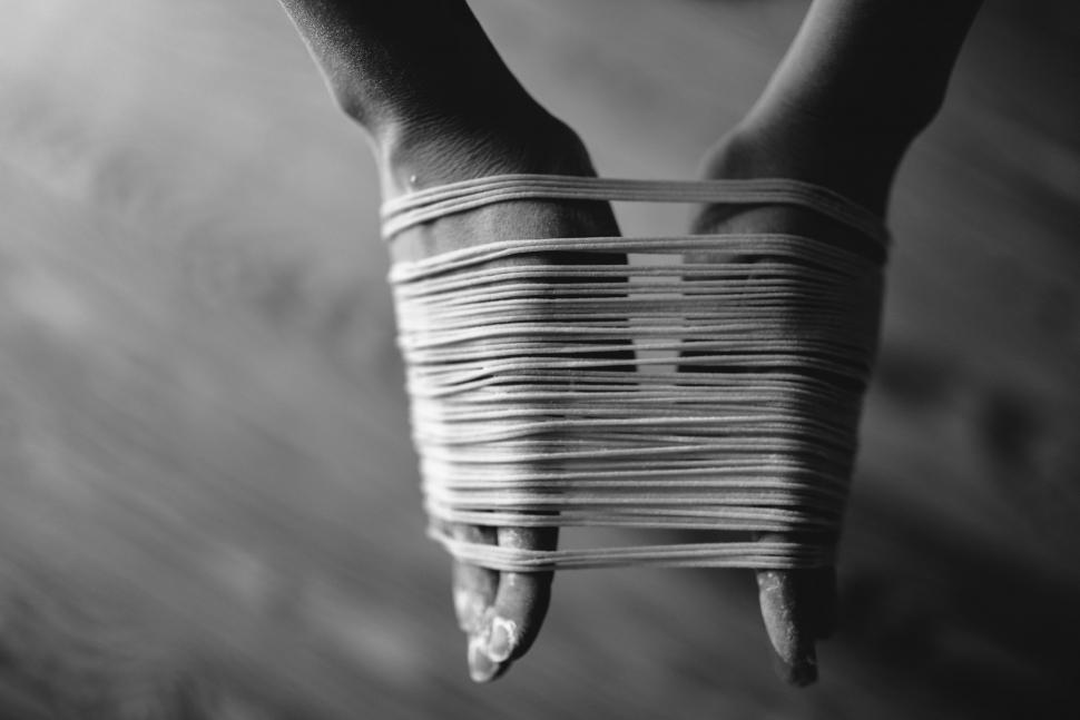 Free Image of Womans Hands Wrapped in String 