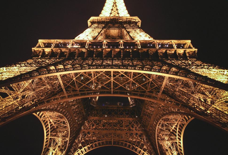 Free Image of The Iconic Eiffel Tower Illuminated at Night 