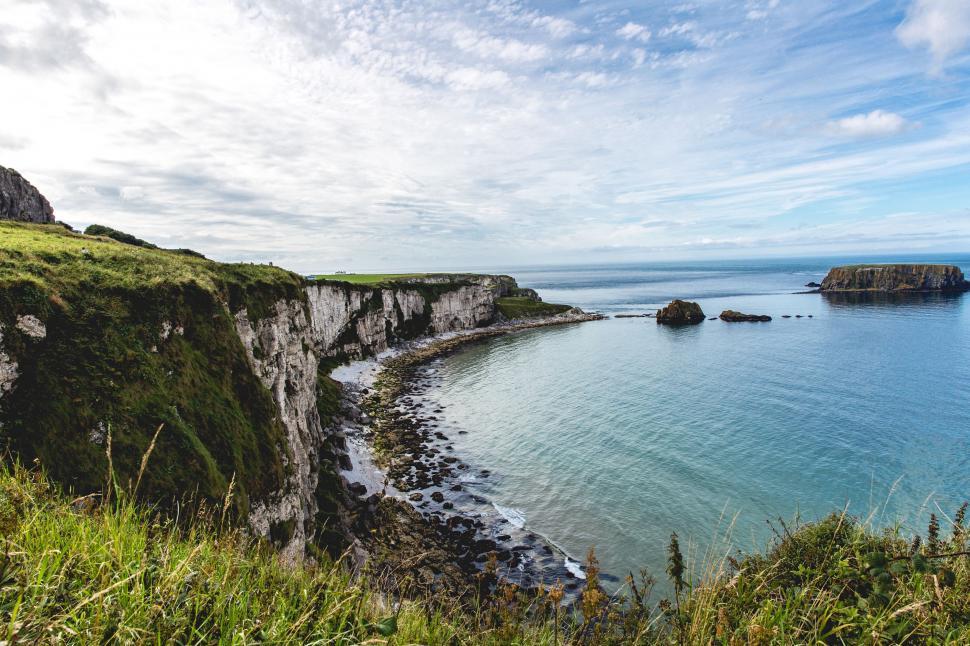 Free Image of A View of a Body of Water Near a Cliff 
