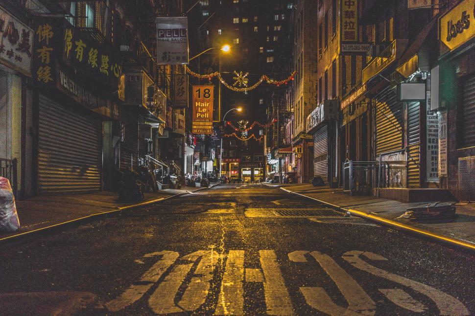 Free Image of Empty City Street at Night With Lights On 