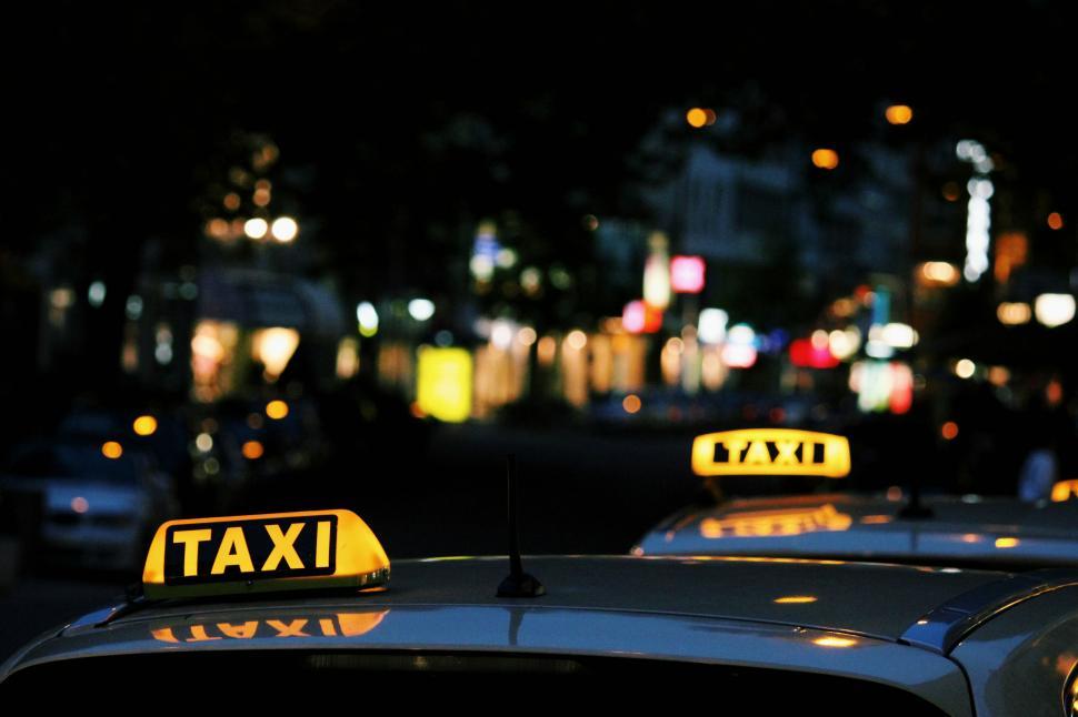 Free Image of Taxi Cabs Sitting in the Street 