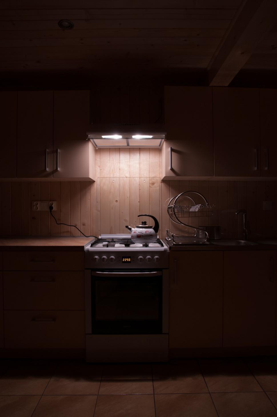 Free Image of Dimly Lit Kitchen With Sink and Stove 