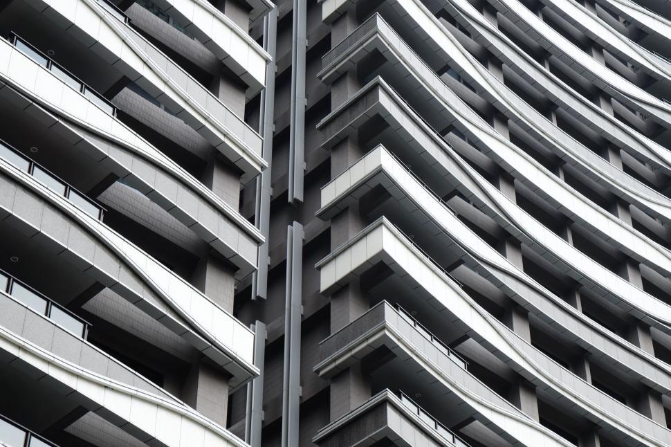 Free Image of Black and White Photo of a Building With Balconies 