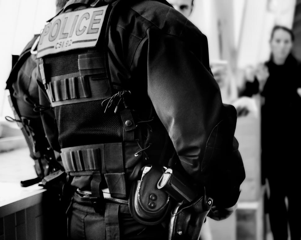 Free Image of Police Officer Standing in Front of Counter 