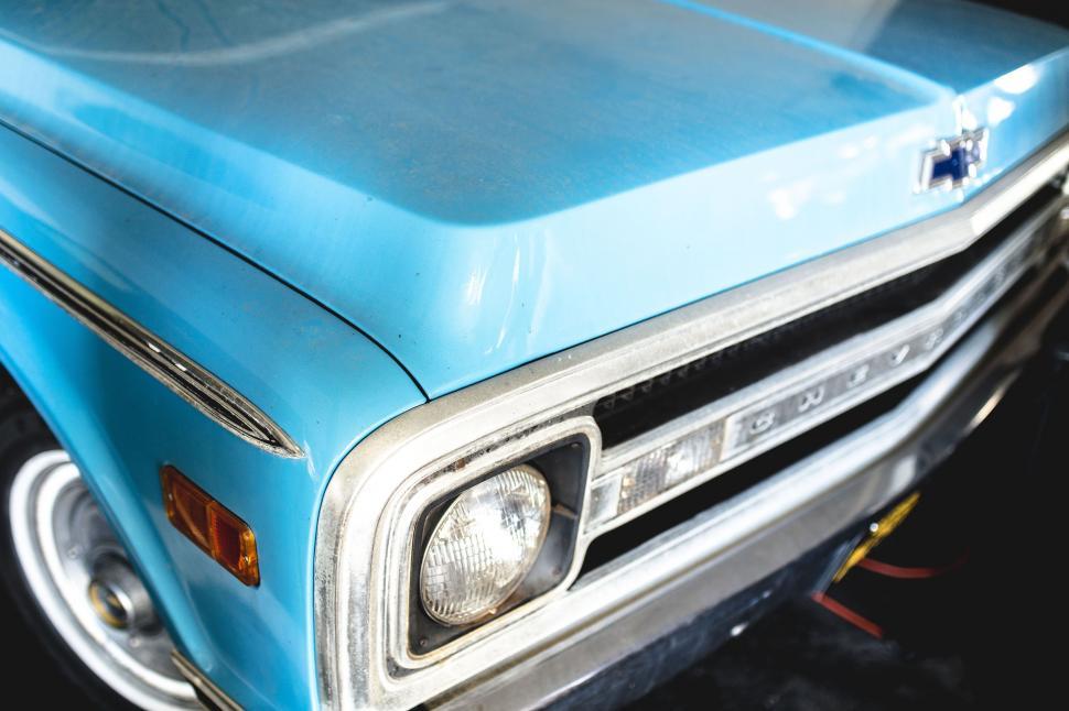 Free Image of Close Up of the Front of a Blue Truck 