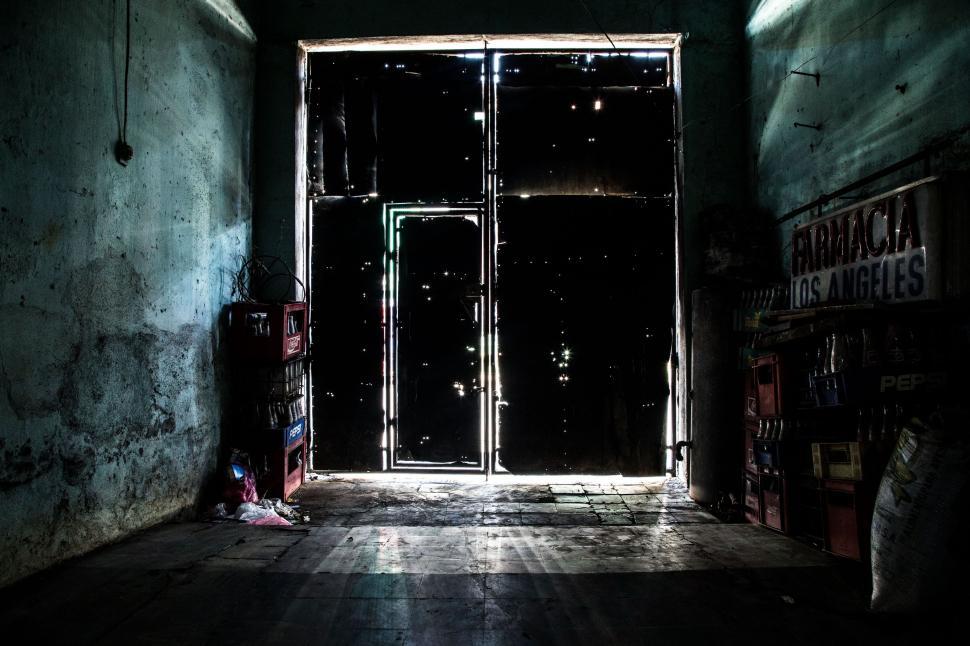 Free Image of Dark Room With Door and Sign 