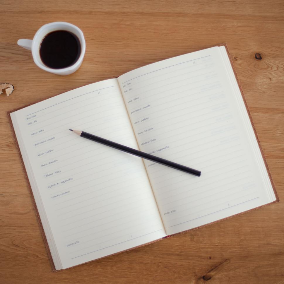 Free Image of Open Notebook, Pen, and Cup of Coffee 