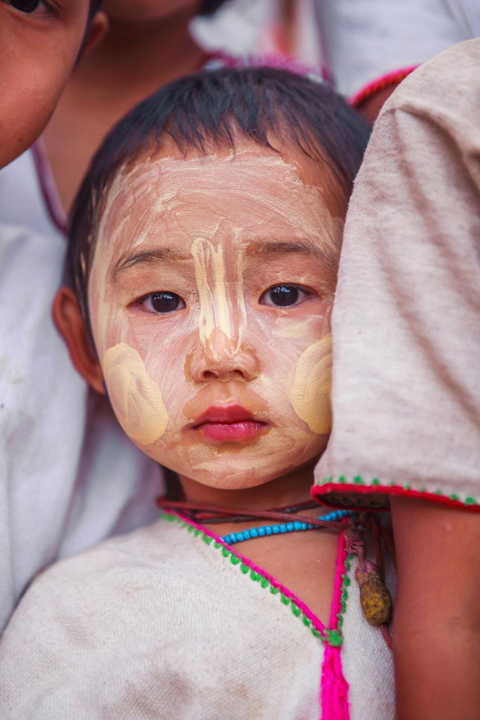 Free Image of Young Child With Face Painted as Woman 
