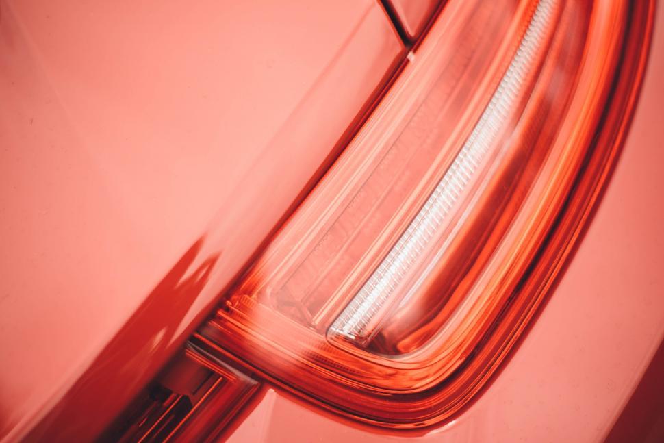 Free Image of Close Up Of A Red Car Tail Light 